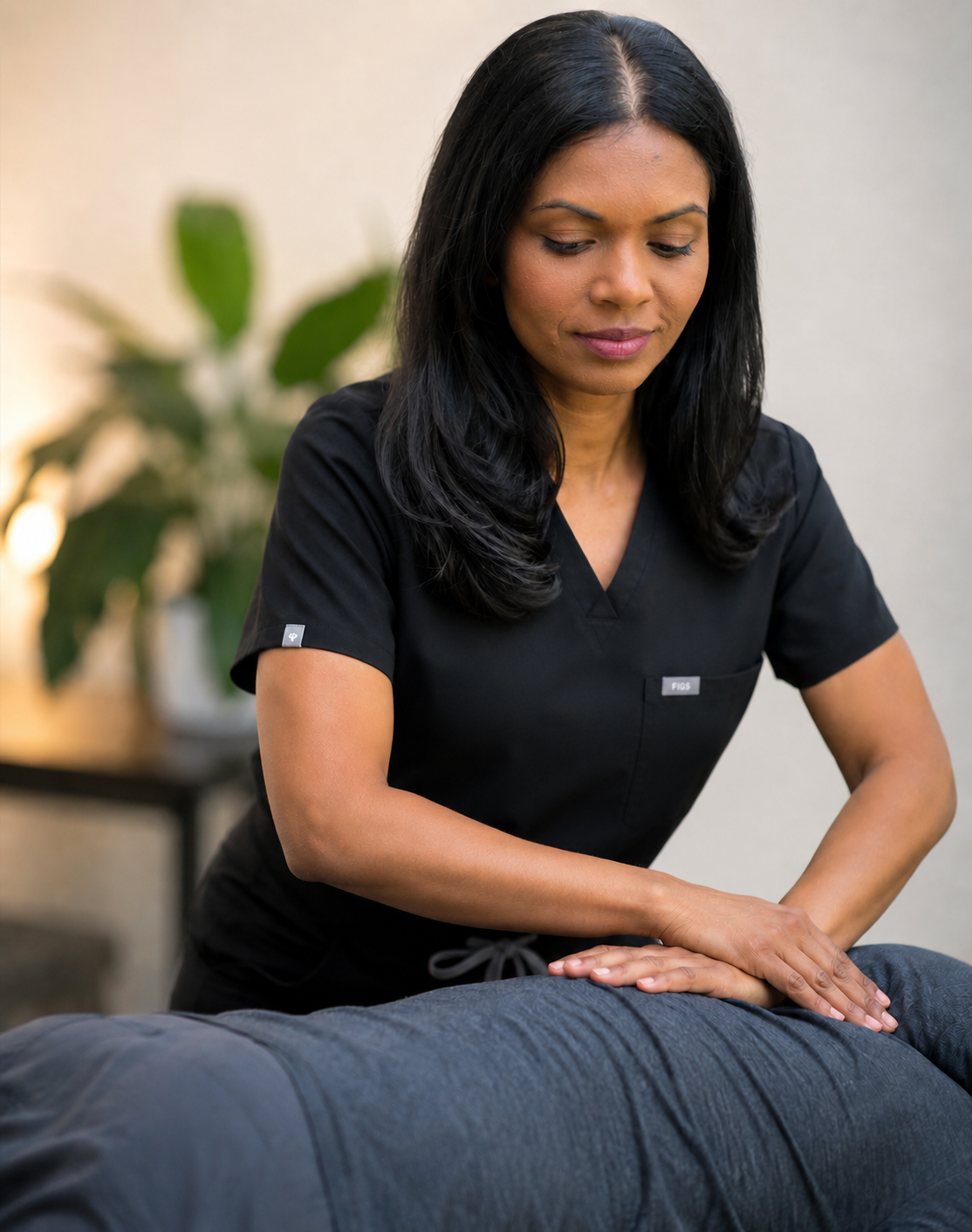 Dr. Nelly Singh performing osteopathic manipulative treatment